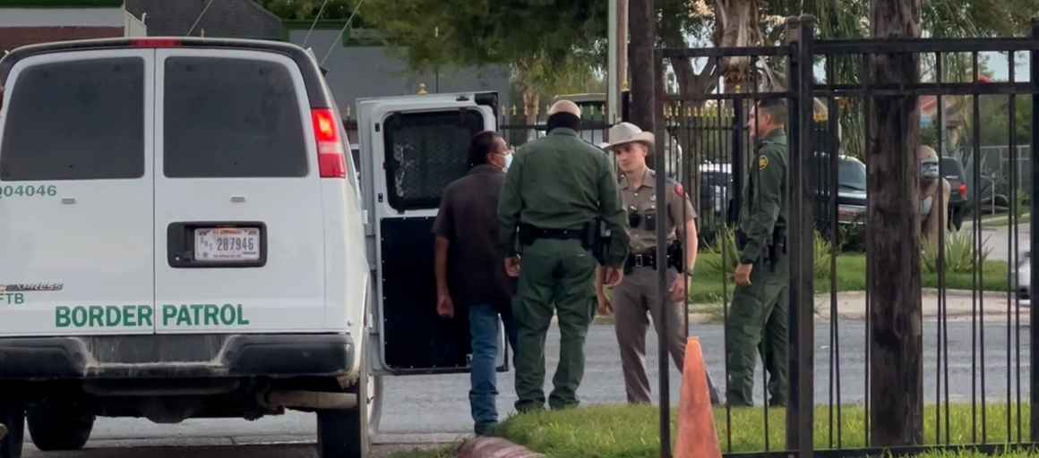 image of border patrol detaining someone