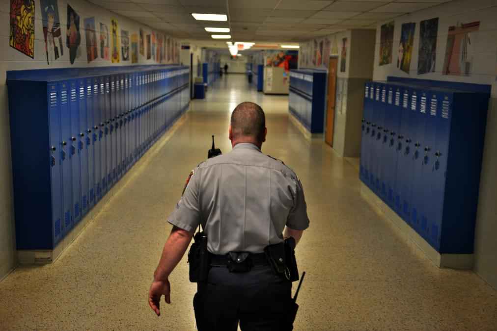 A school resource officer walks the halls