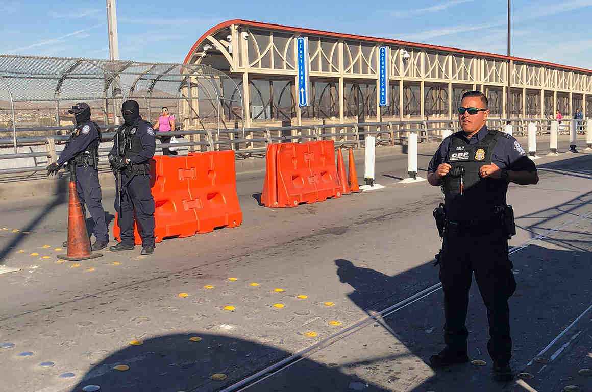 Customs and Border protection agents stand at a checkpoint