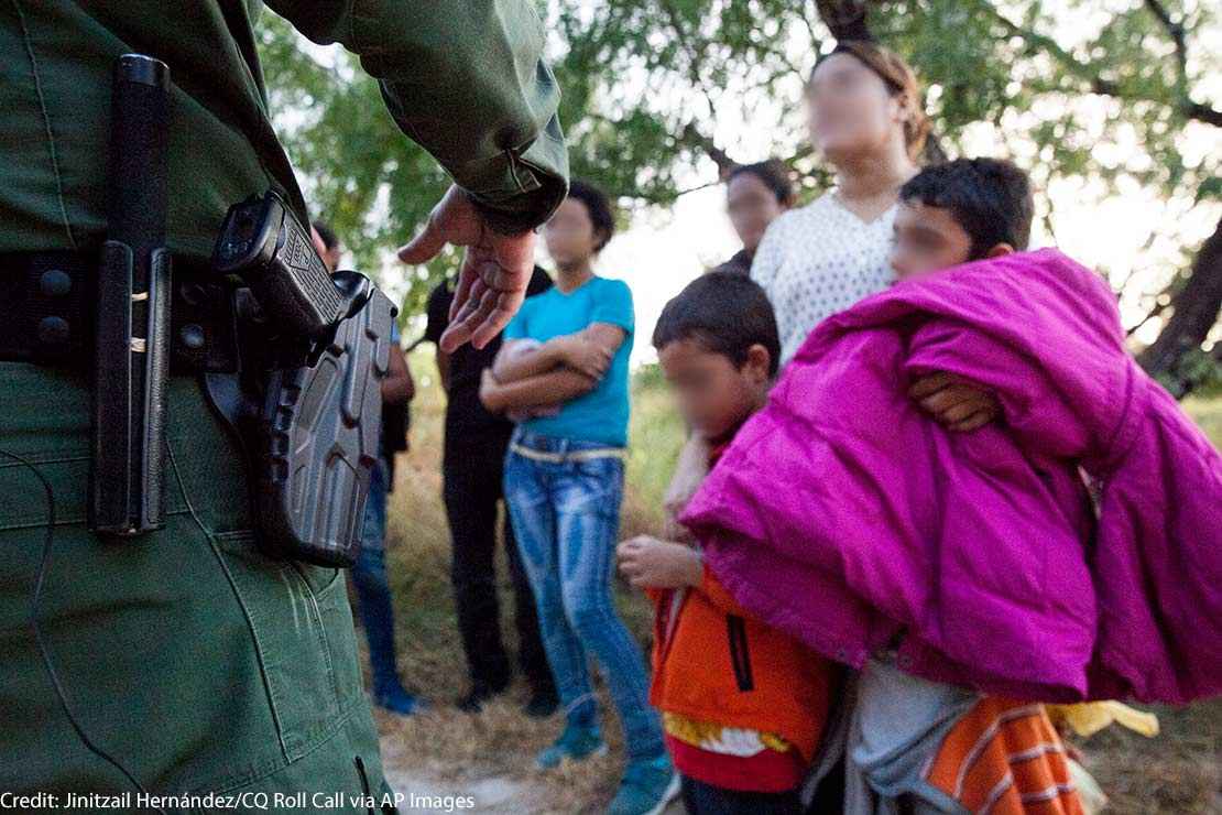 A Customs and Border Protection officer questions immigrants in Rio Grande Valley sector of the Texas border on Aug. 20, 2019.