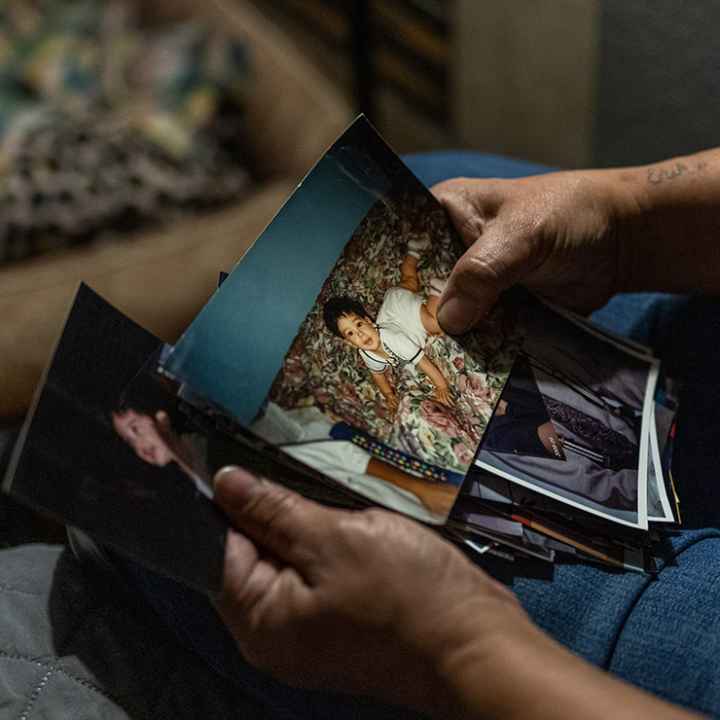 An ACLU client looking at family photos.