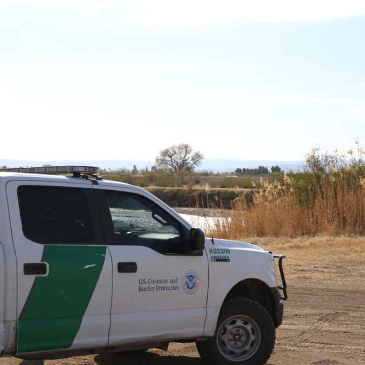 Photograph of a Customs and Border Protection truck parked on the side of the road