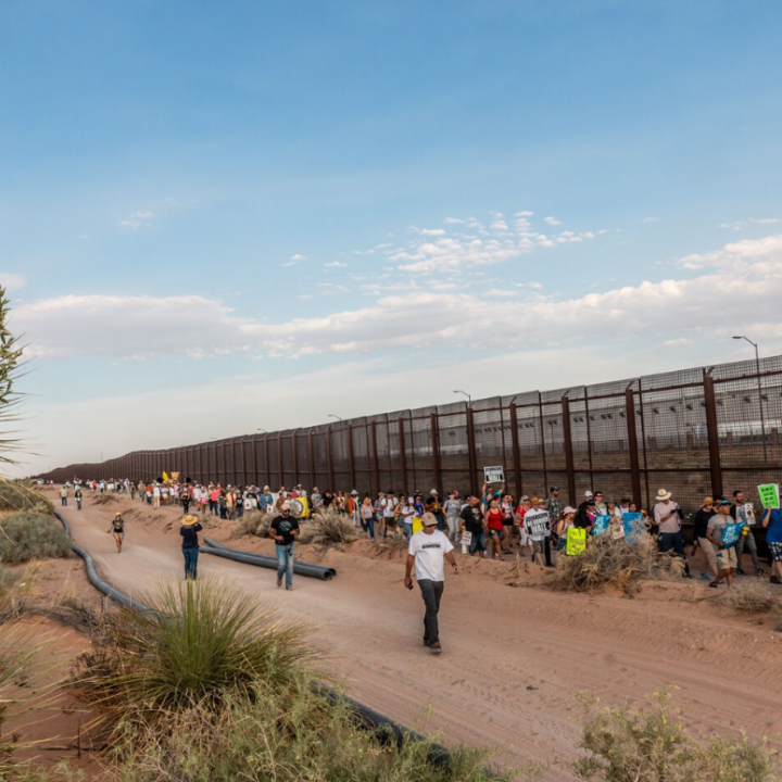 Border Wall Photo: Immigrants' rights supporters lined up to march alongside a stretch of Border Wall in El Paso, Texas