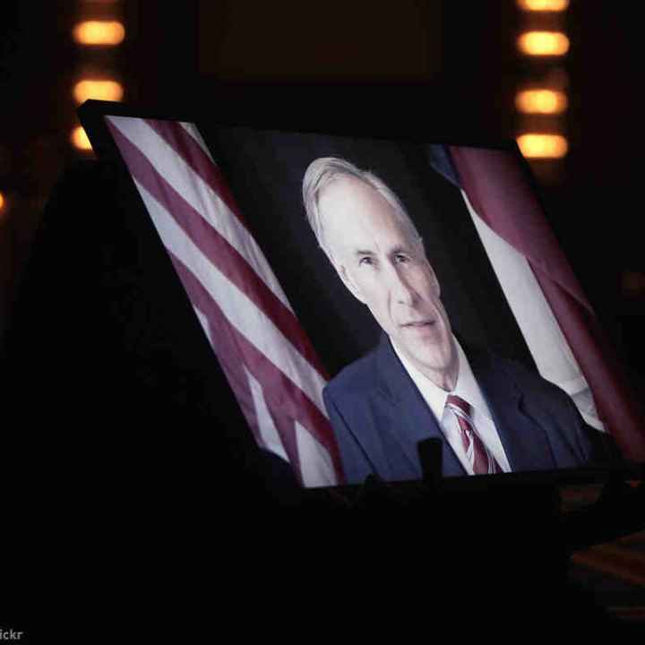 Greg Abbott on TV monitor screen