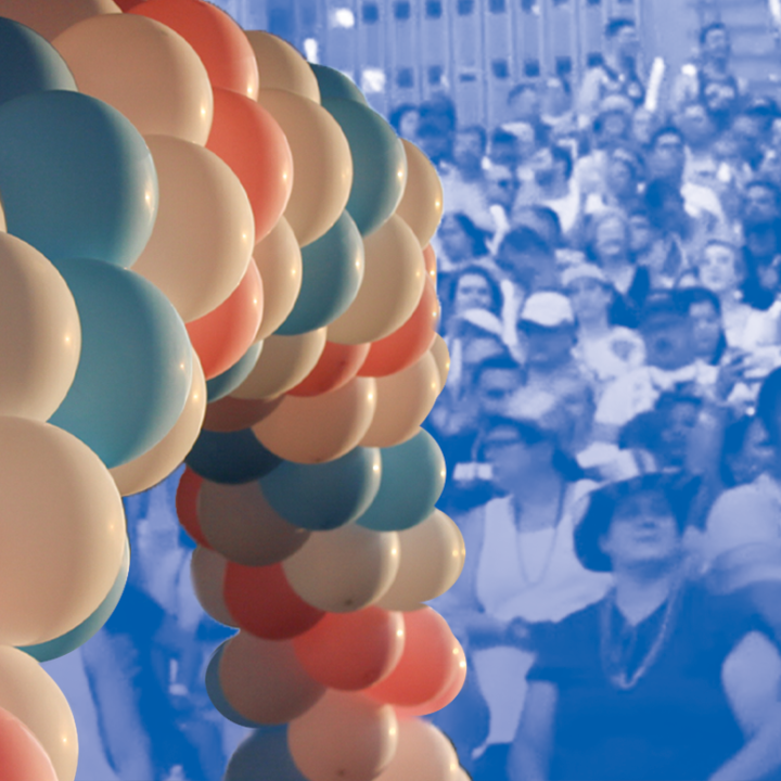 Trans Awareness Week Image: An image of balloon arch with alternating trans pride colors overlaps a stylized image of a crowd of people gathered.